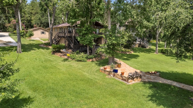 1831 Lakeview Estates Dr, Coldspring, TX 77331 - view of green lawn with stairway, a deck, and view of wooded area