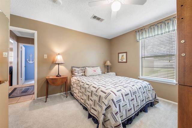 1831 Lakeview Estates Dr, Coldspring, TX 77331 - bedroom with carpet floors, a ceiling fan, and a textured ceiling