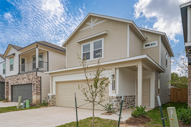 14979 Eagle Feather Dr, Houston, TX 77090 - view of front of house featuring stone siding, a garage, and driveway