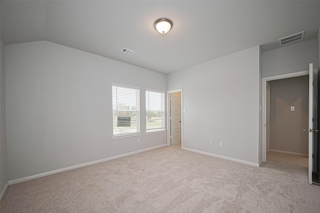 14979 Eagle Feather Dr, Houston, TX 77090 - unfurnished bedroom featuring light carpet and lofted ceiling