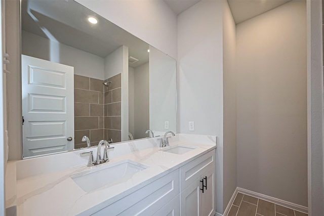 14979 Eagle Feather Dr, Houston, TX 77090 - bathroom with double vanity and a tile shower