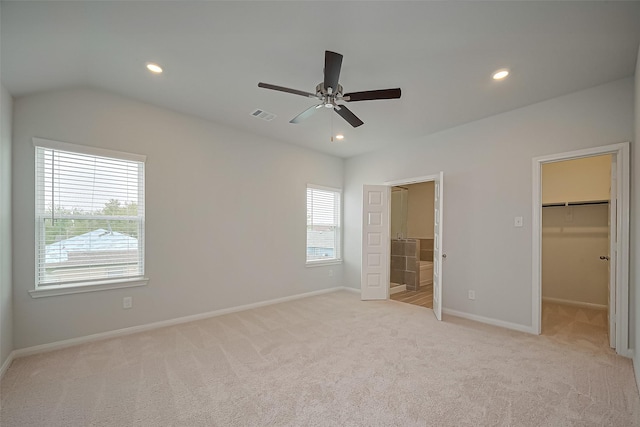 14979 Eagle Feather Dr, Houston, TX 77090 - unfurnished bedroom with light colored carpet, a spacious closet, recessed lighting, ensuite bath, and ceiling fan