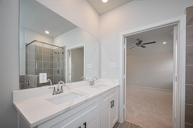 14979 Eagle Feather Dr, Houston, TX 77090 - bathroom featuring double vanity, ceiling fan, and a tile shower