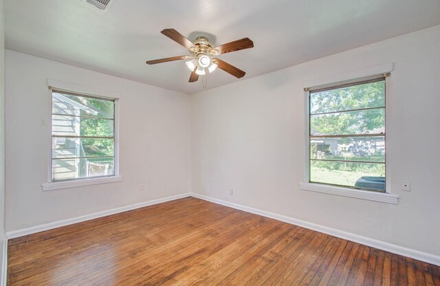 1708 S Park Dr, Alvin, TX 77511 - unfurnished room featuring healthy amount of natural light, light wood-style flooring, and ceiling fan