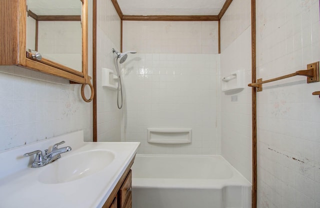 1708 S Park Dr, Alvin, TX 77511 - bathroom with vanity, tub / shower combination, and tile walls