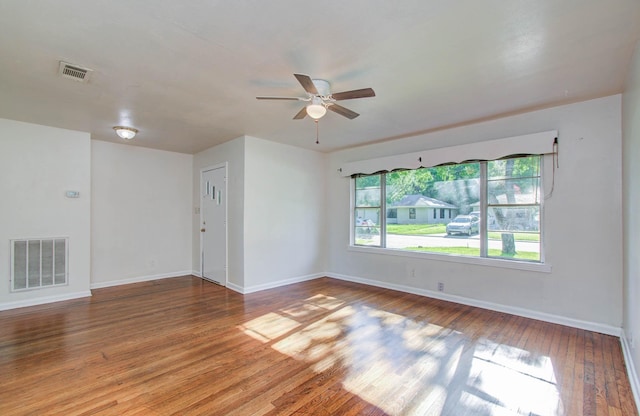 1708 S Park Dr, Alvin, TX 77511 - empty room featuring a ceiling fan and hardwood / wood-style floors