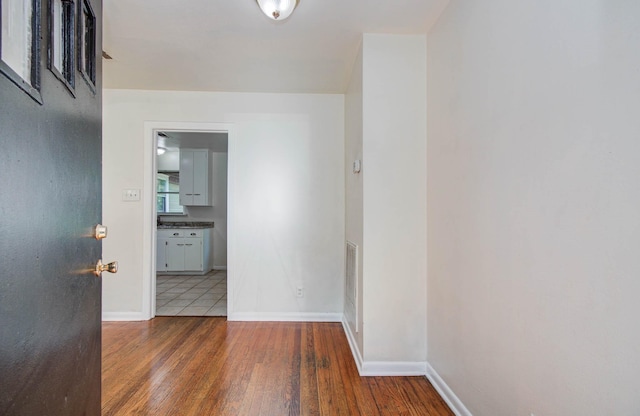 1708 S Park Dr, Alvin, TX 77511 - corridor featuring wood finished floors and baseboards