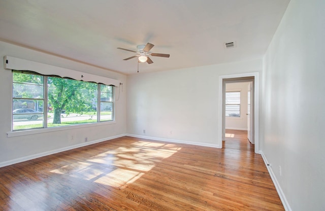 1708 S Park Dr, Alvin, TX 77511 - spare room featuring plenty of natural light, light wood finished floors, and a ceiling fan