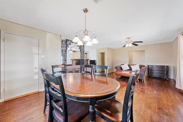 3310 Lake Heights Dr, Waco, TX 76708 - dining space with a ceiling fan, a chandelier, and wood finished floors