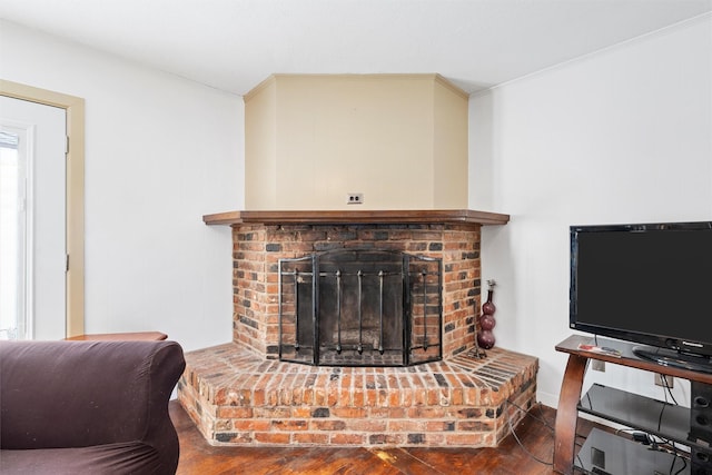 3310 Lake Heights Dr, Waco, TX 76708 - living room featuring wood finished floors, a brick fireplace, and ornamental molding