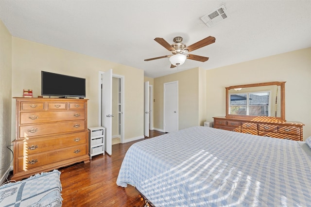 3310 Lake Heights Dr, Waco, TX 76708 - bedroom featuring dark wood-style floors, a ceiling fan, and radiator