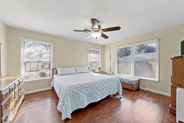 3310 Lake Heights Dr, Waco, TX 76708 - bedroom featuring dark wood-style flooring, a textured ceiling, and ceiling fan