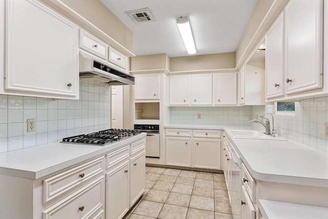 9622 Highmeadow Dr, Houston, TX 77063 - kitchen featuring white appliances, under cabinet range hood, light countertops, and tasteful backsplash