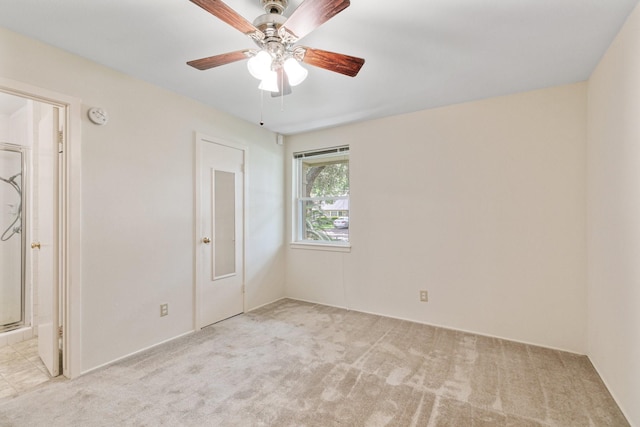 9622 Highmeadow Dr, Houston, TX 77063 - unfurnished bedroom featuring light carpet, ensuite bathroom, and a ceiling fan
