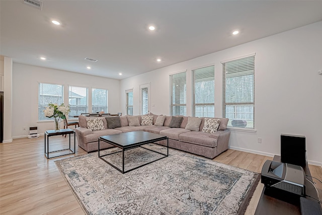 23722 Canolo Grove Ln, New Caney, TX 77357 - living area featuring light wood finished floors and recessed lighting