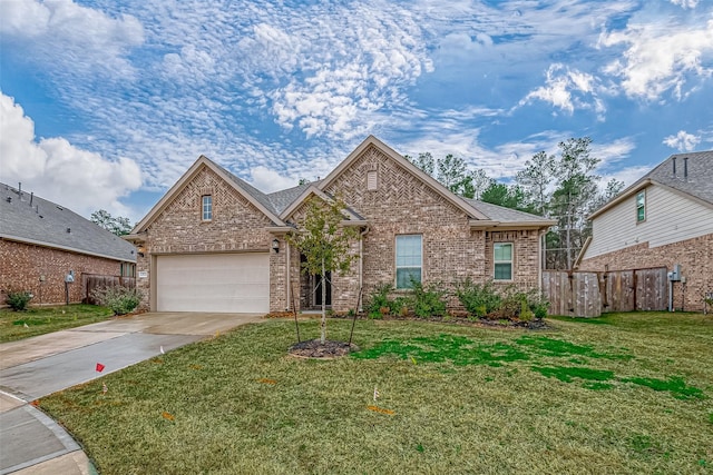 23722 Canolo Grove Ln, New Caney, TX 77357 - traditional home featuring concrete driveway, a garage, and brick siding
