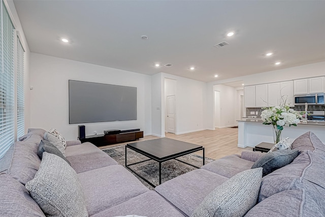 23722 Canolo Grove Ln, New Caney, TX 77357 - living room featuring recessed lighting and light wood-style floors