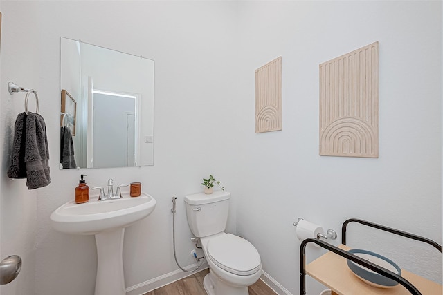 23722 Canolo Grove Ln, New Caney, TX 77357 - half bathroom with toilet and wood finished floors