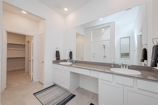 23722 Canolo Grove Ln, New Caney, TX 77357 - bathroom with double vanity, walk in shower, and a spacious closet