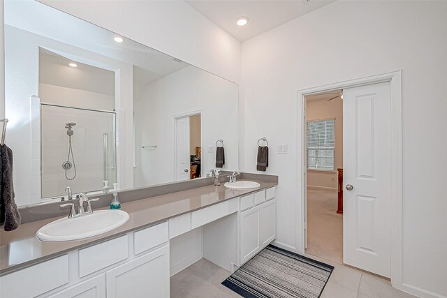23722 Canolo Grove Ln, New Caney, TX 77357 - full bathroom featuring double vanity, tile patterned floors, a shower, and recessed lighting