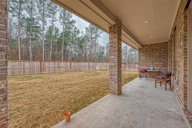 23722 Canolo Grove Ln, New Caney, TX 77357 - fenced backyard with a patio area