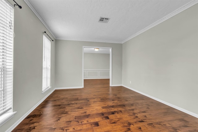 8115 Winding Oak Ln, Spring, TX 77379 - spare room with a textured ceiling, wood finished floors, and crown molding