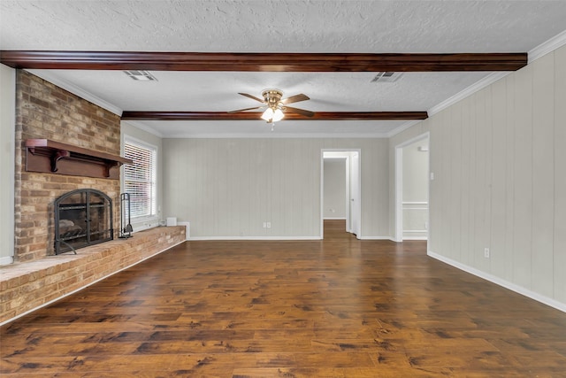 8115 Winding Oak Ln, Spring, TX 77379 - unfurnished living room featuring dark wood-style floors, a ceiling fan, beam ceiling, a textured ceiling, and a fireplace