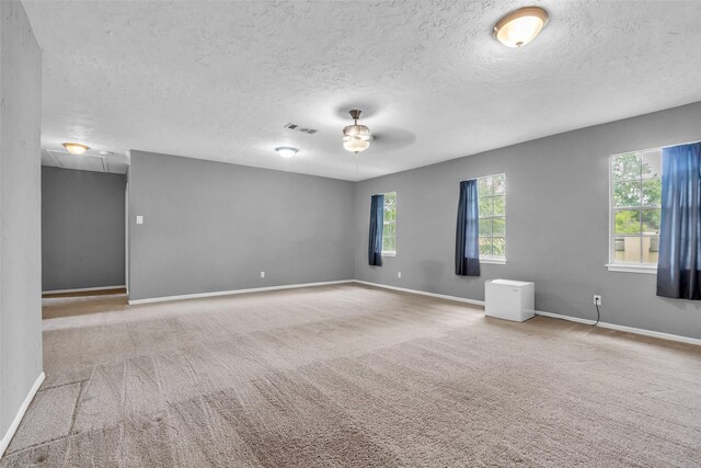 8115 Winding Oak Ln, Spring, TX 77379 - carpeted spare room with a ceiling fan and a textured ceiling