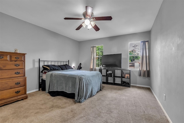 8115 Winding Oak Ln, Spring, TX 77379 - carpeted bedroom with baseboards and ceiling fan