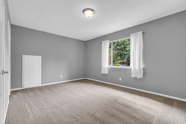 8115 Winding Oak Ln, Spring, TX 77379 - empty room with carpet floors and baseboards