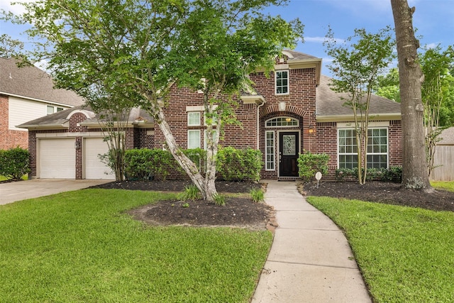 2010 Cias Trail Ln, Spring, TX 77386 - view of front of house with brick siding, a front yard, an attached garage, and driveway