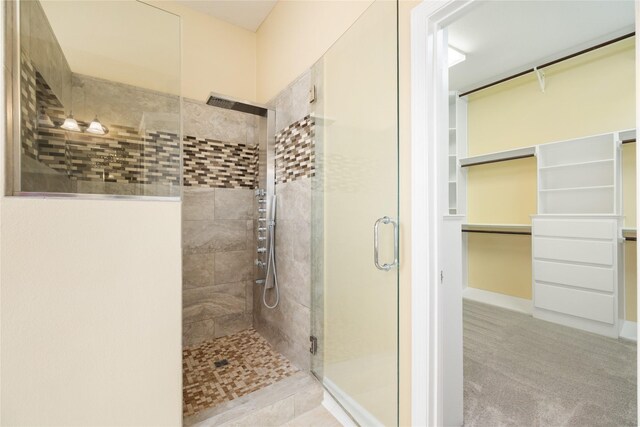 2010 Cias Trail Ln, Spring, TX 77386 - bathroom featuring a stall shower and a walk in closet