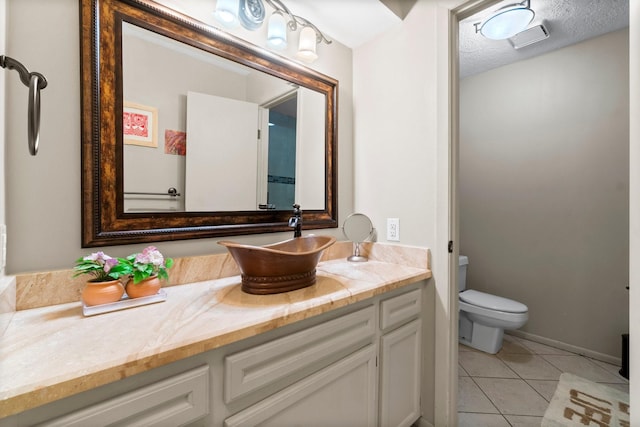 145 Capetown, Montgomery, TX 77356 - bathroom with vanity, tile patterned flooring, and a textured ceiling