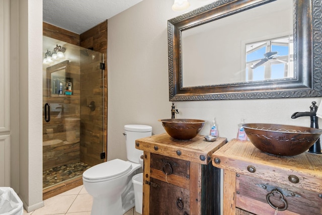 145 Capetown, Montgomery, TX 77356 - full bathroom featuring a shower stall, tile patterned flooring, and vanity