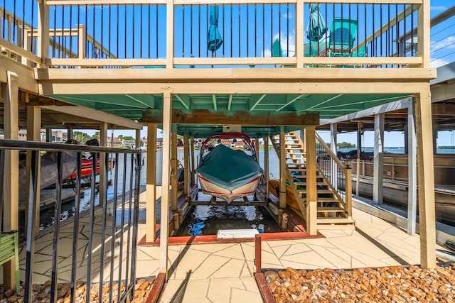 145 Capetown, Montgomery, TX 77356 - view of patio featuring boat lift, a dock, and stairs