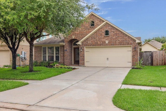 3112 Rock Brook Falls Ln, League City, TX 77573 - view of front of property with brick siding, concrete driveway, and an attached garage