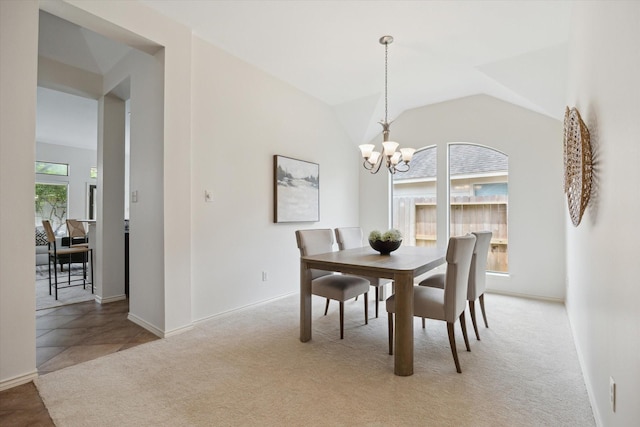 3112 Rock Brook Falls Ln, League City, TX 77573 - dining space with a chandelier, light colored carpet, and lofted ceiling