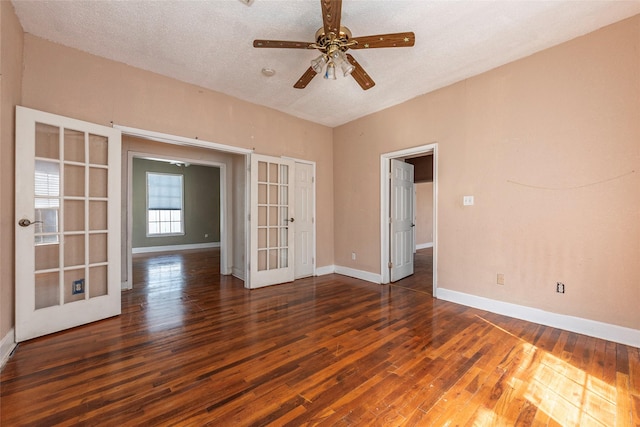 7609 Avenue Ave E, Houston, TX 77012 - unfurnished room with french doors, a ceiling fan, wood finished floors, and a textured ceiling