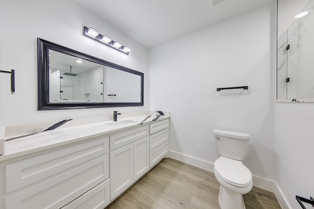 25050 Shady Oak Dr, Hockley, TX 77447 - bathroom featuring wood finished floors, vanity, and a marble finish shower