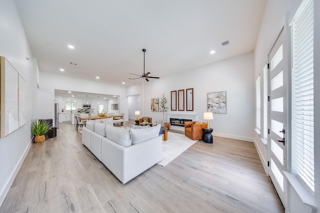 25050 Shady Oak Dr, Hockley, TX 77447 - living room with a ceiling fan, light wood finished floors, and recessed lighting