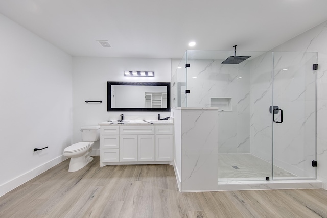 25050 Shady Oak Dr, Hockley, TX 77447 - full bath featuring a marble finish shower, vanity, wood finished floors, and recessed lighting