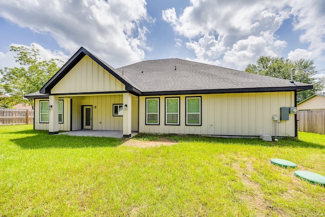 25050 Shady Oak Dr, Hockley, TX 77447 - rear view of property with roof with shingles, a patio, and board and batten siding