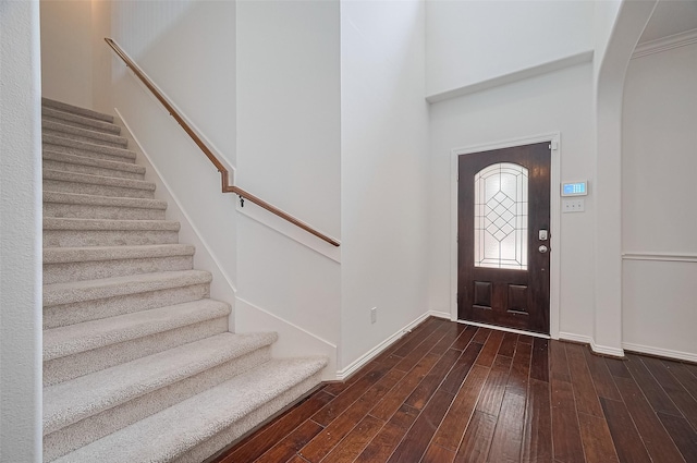 4142 Regal Stone Ln, Sugar Land, TX 77479 - entryway with stairs, wood finished floors, and arched walkways