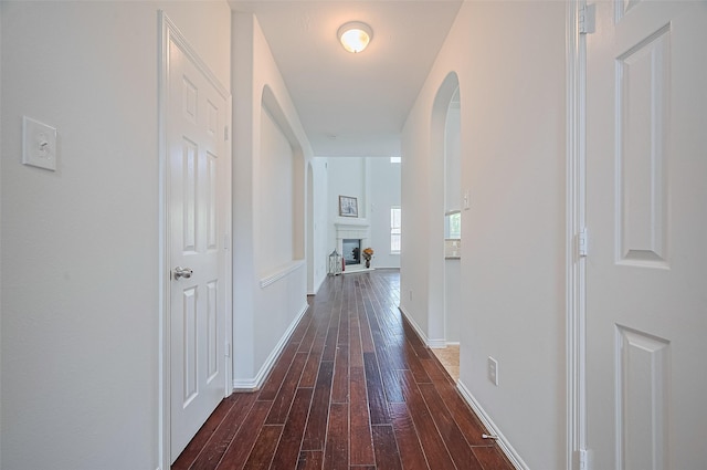 4142 Regal Stone Ln, Sugar Land, TX 77479 - hallway with arched walkways and dark wood-type flooring