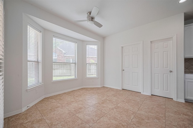 4142 Regal Stone Ln, Sugar Land, TX 77479 - unfurnished bedroom with ceiling fan and light tile patterned floors