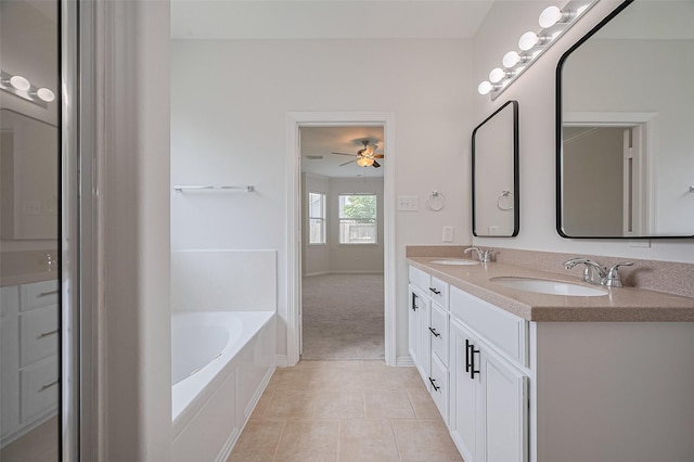 4142 Regal Stone Ln, Sugar Land, TX 77479 - bathroom featuring double vanity, a bath, tile patterned flooring, and a ceiling fan
