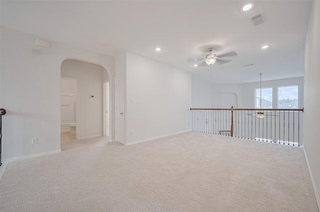 4142 Regal Stone Ln, Sugar Land, TX 77479 - unfurnished room featuring ceiling fan, recessed lighting, arched walkways, and light carpet