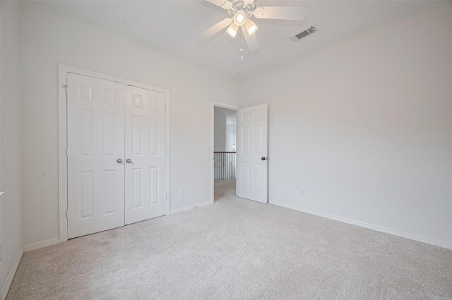 4142 Regal Stone Ln, Sugar Land, TX 77479 - unfurnished bedroom with light carpet, a closet, and ceiling fan