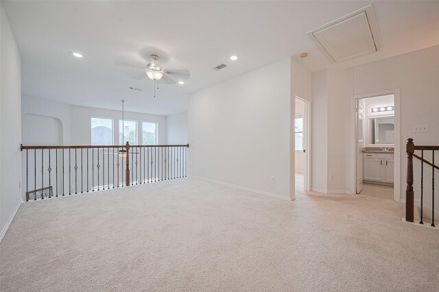 4142 Regal Stone Ln, Sugar Land, TX 77479 - empty room featuring attic access, ceiling fan, light carpet, and recessed lighting
