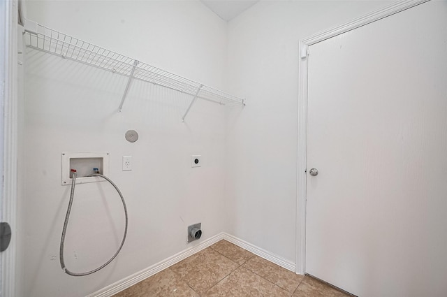4142 Regal Stone Ln, Sugar Land, TX 77479 - laundry area with hookup for an electric dryer, washer hookup, light tile patterned floors, and gas dryer hookup